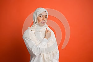 Happy arab woman in hijab. Portrait of smiling girl, posing at studio background