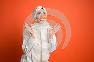 Happy arab woman in hijab. Portrait of smiling girl, posing at studio background