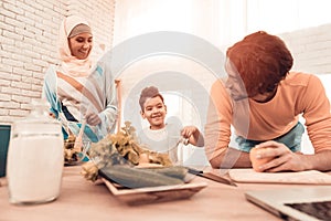 Happy Arabian Family Cooking Food in Kitchen.