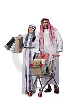 The happy arabic family after shopping isolated on white