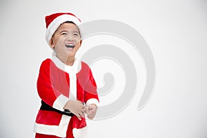 Happy asian baby boy laughing and having fun in a Christmas costume Santa Claus  on white background