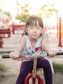 Happy asian baby child playing on playground