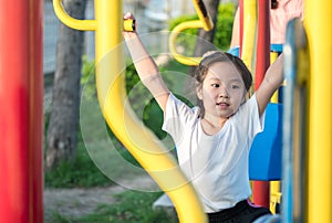 Happy asian baby child playing on playground