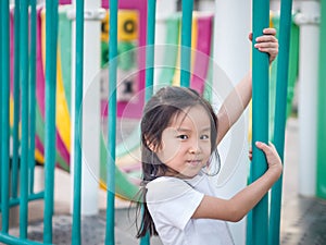 Happy asian baby child playing on playground