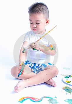 Happy asian baby childhood use paintbrush draw water color or fingerpaint