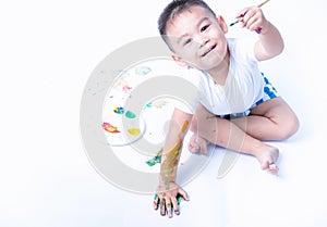 Happy asian baby childhood use paintbrush draw water color or fingerpaint