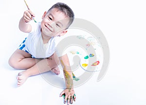 Happy asian baby childhood use paintbrush draw water color or fingerpaint