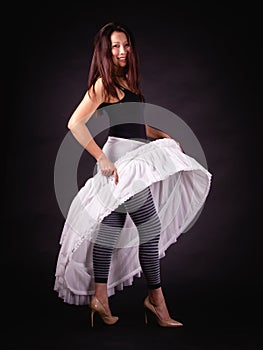 Happy Asian beautiful woman in a white fluffy skirt