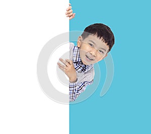 Happy Asian boy holding with white empty banner