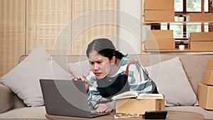 Happy Asian business owner woman crazy joyful ecstatic face gesture amazed approve on laptop computer. Shopping Online