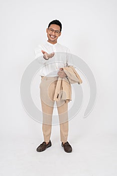 A happy Asian businessman is opening his palm at the camera, isolated white background
