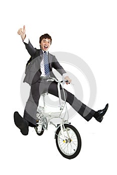 Happy asian businessman riding bike