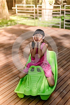 Happy Asian chidren playing at playground photo