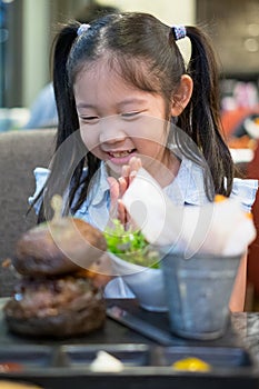 Happy Asian Child, Girl, Excited with Burger