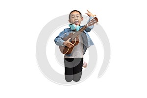 Happy Asian child girl jumping play ukulele, isolate on white