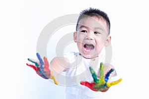 Happy asian child kid smile on education art show hand with water color or finger paint on hands