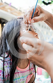 asian Child preschooler with face painting. Make up.