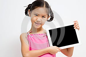 Happy Asian child with tablet computer