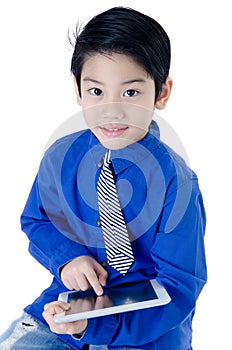 Happy Asian child with tablet computer on isolated background