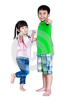 Happy asian children posing in the studio, isolated on white background.