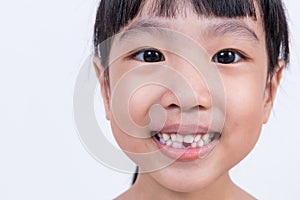 Happy Asian Chinese little girl with toothless smile photo
