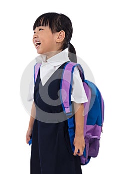 Happy Asian Chinese little girl wearing primary school uniform