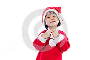 Happy Asian Chinese little girl wearing santa claus costume