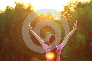 Happy Asian Chinese woman embrace nature and sun