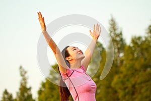 Happy Asian Chinese woman embrace nature and sun