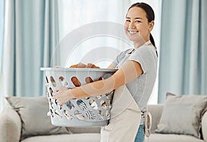 Happy Asian cleaner woman with laundry working for home, house or hotel hospitality cleaning help service agency