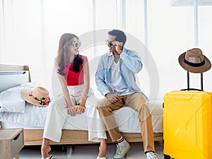 Happy Asian couple in summer, young man and woman wearing sunglasses with smile.