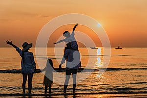 Happy asian family at consisting father, mother, son and daughter