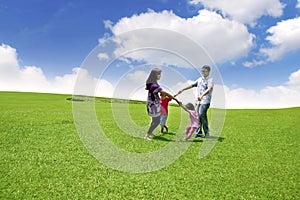 Happy Asian Family on Field