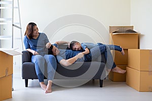 Happy Asian family having fun during moving day and relocating at new home.