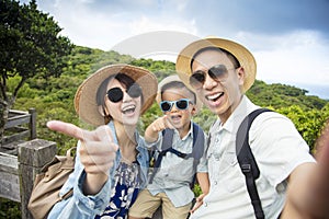 Happy asian Family On Hiking Adventure and taking selfie