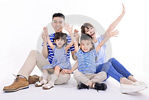 Happy asian family looking at camera and  sitting on white background