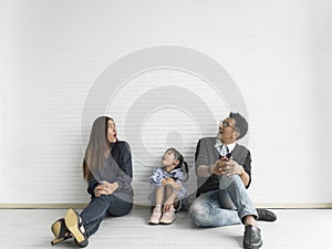 Happy asian family looking up. copy space