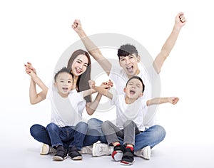 Happy Asian family  sitting on white floor