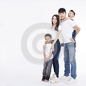 Happy Asian family standing together on white background