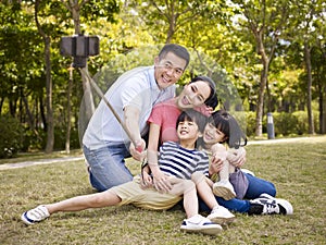 Happy asian family taking a selfie