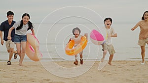 Happy Asian family travel beach on holiday vacation
