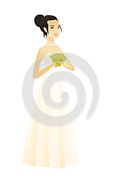 Happy asian fiancee holding money.