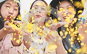 Happy asian friends having fun throwing confetti at party outdoor - Young trendy people enjoying fest event - Hangout, friendship