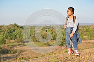 Happy Asian girl backpack in nature backgroun