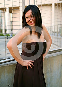 Happy Asian Girl In Fashion Dress Laughing