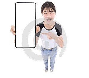 Happy Asian girl holding smartphone mockup of blank screen