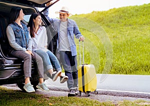 Happy asian group of friends with car travel driving and suitcase