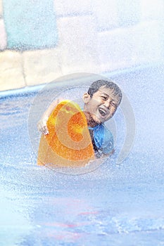 Happy asian kid at swimming pool