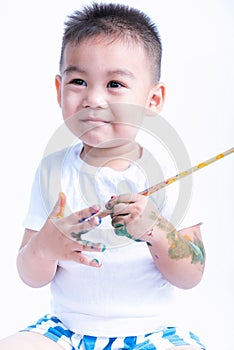Happy asian little baby childhood playing use paintbrush draw watercolor