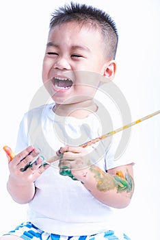 Happy asian little baby childhood playing use paintbrush draw watercolor or fingerpaint